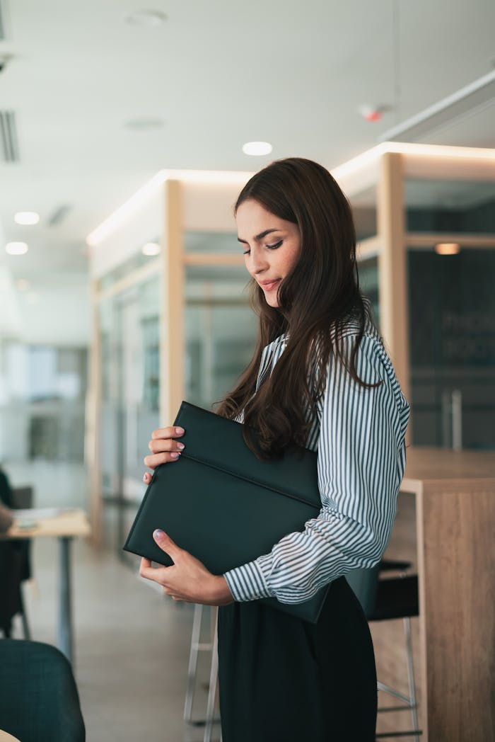 Portrait of Woman in Shirt in Office